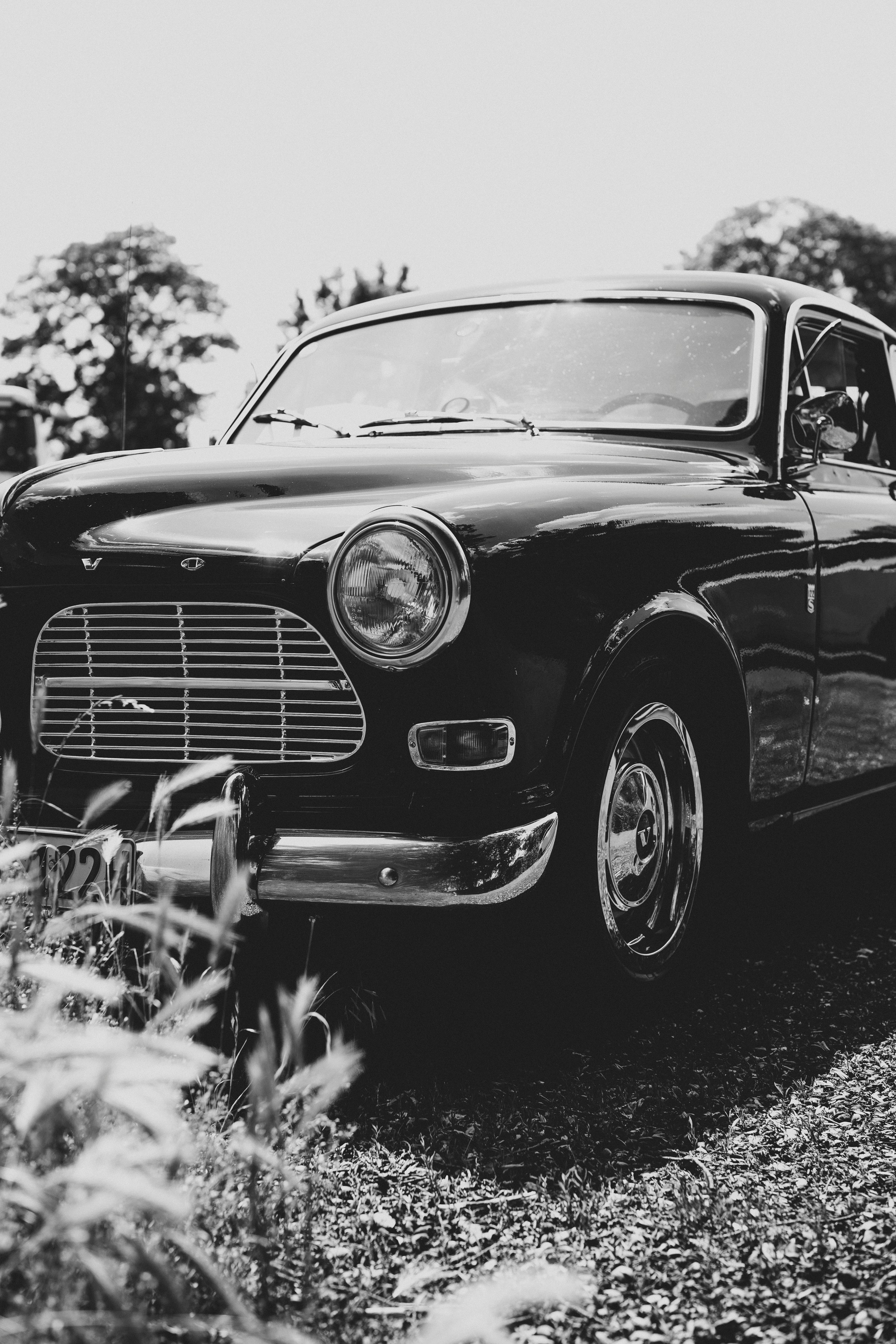 grayscale photo of vintage car